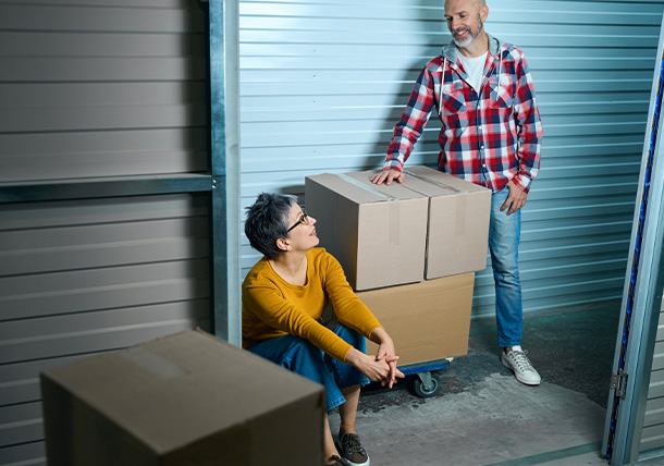 office moving team setting up workspace with several boxes and plants in a bright room featuring large windows and wooden flooring 5 steps for a successful move